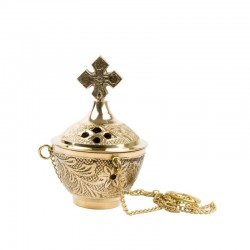 Brûle-encens doré surmonté...