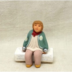 Jeune bouliste assis,...