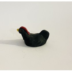 Poule qui couve noire,...